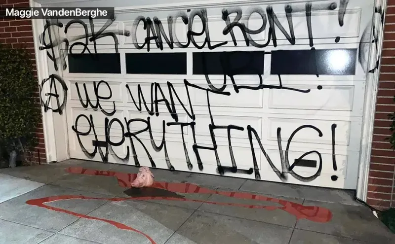 Nancy Pelosi's garage door sprayed with graffiti stating "Cancel rent! We want everything!" with a pig's head on the floor in a pool of blood 